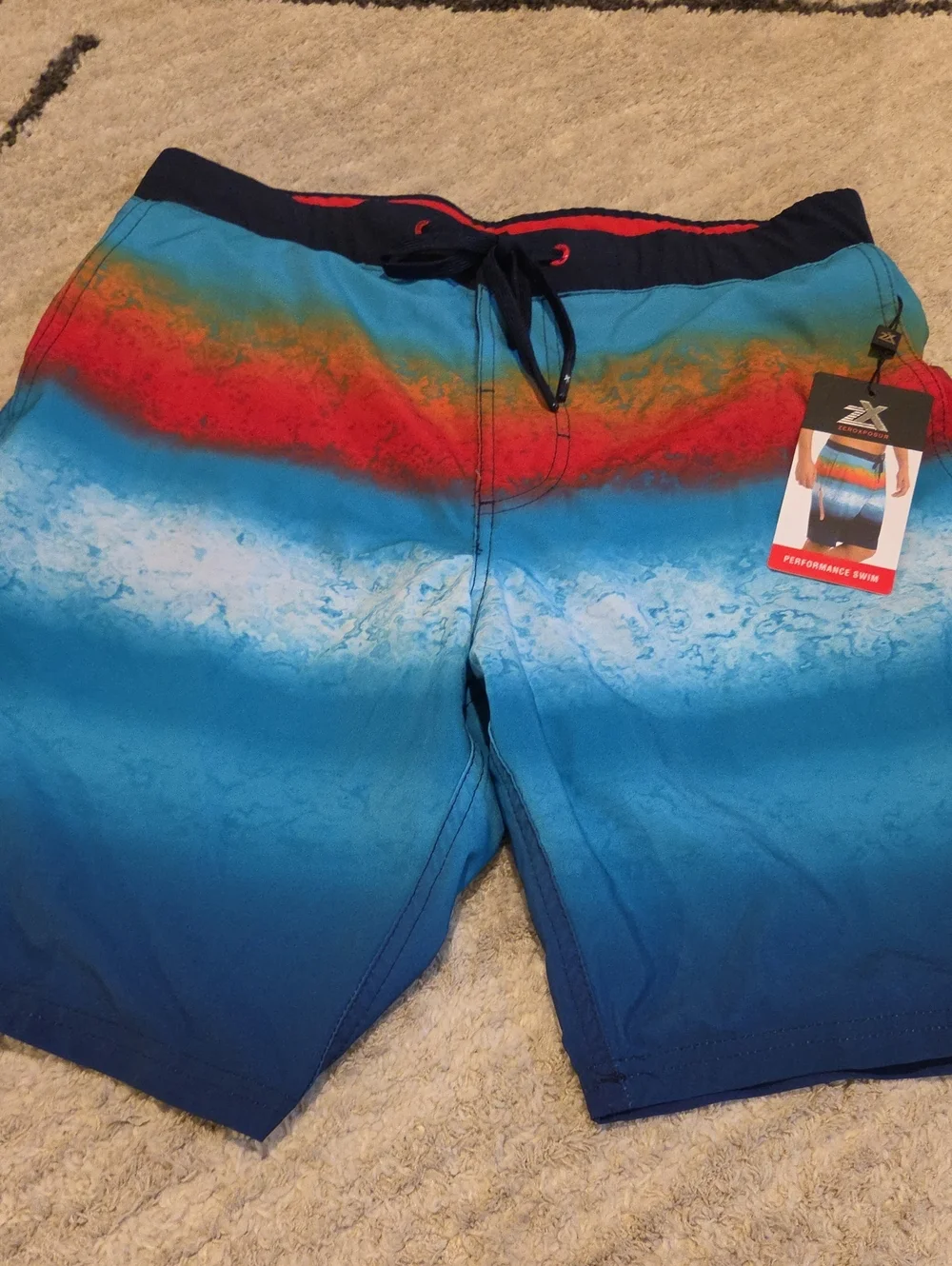 ZeroXposur Men's Blue Gradient Swim Board Shorts with Red Accent